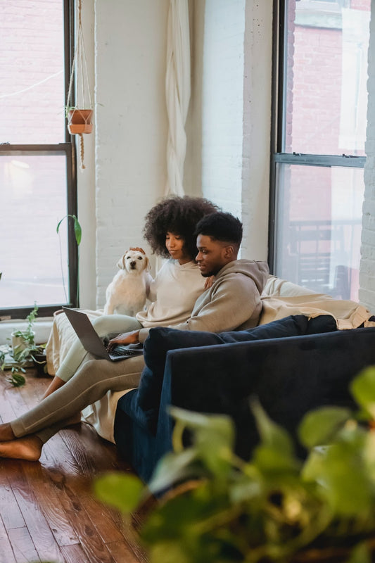 A young couple buying Jesus Walks luxury goods on the Jesus Walks website for their friends and family who are believers, Christians and non Christians.